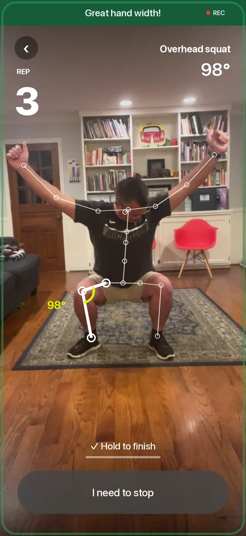 The SCRENR app counting a squat, with the skeleton drawn over the person